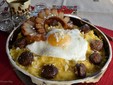 Balmoș with eggs and homemade sausages