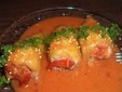 Stuffed peppers in tomato sauce